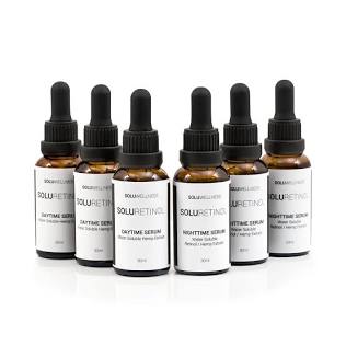 SoluWellness product suite — lineup of amber glass dropper bottles including SoluRetinol Daytime and Nighttime Serums